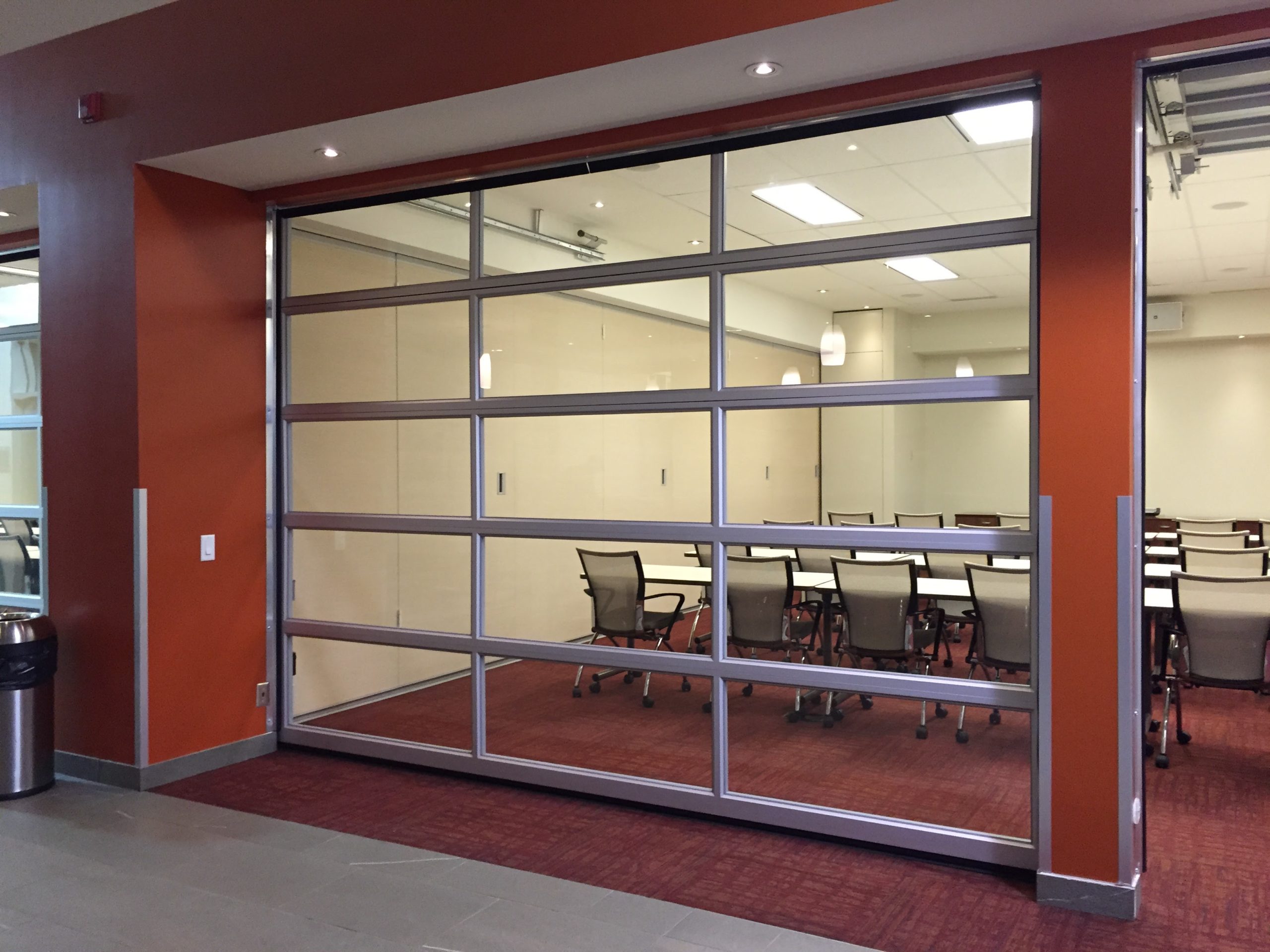 Glass sectional overhead door inside a commercial building