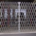 Folding commercial security gate