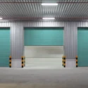 Commercial garage doors that are the color blue.