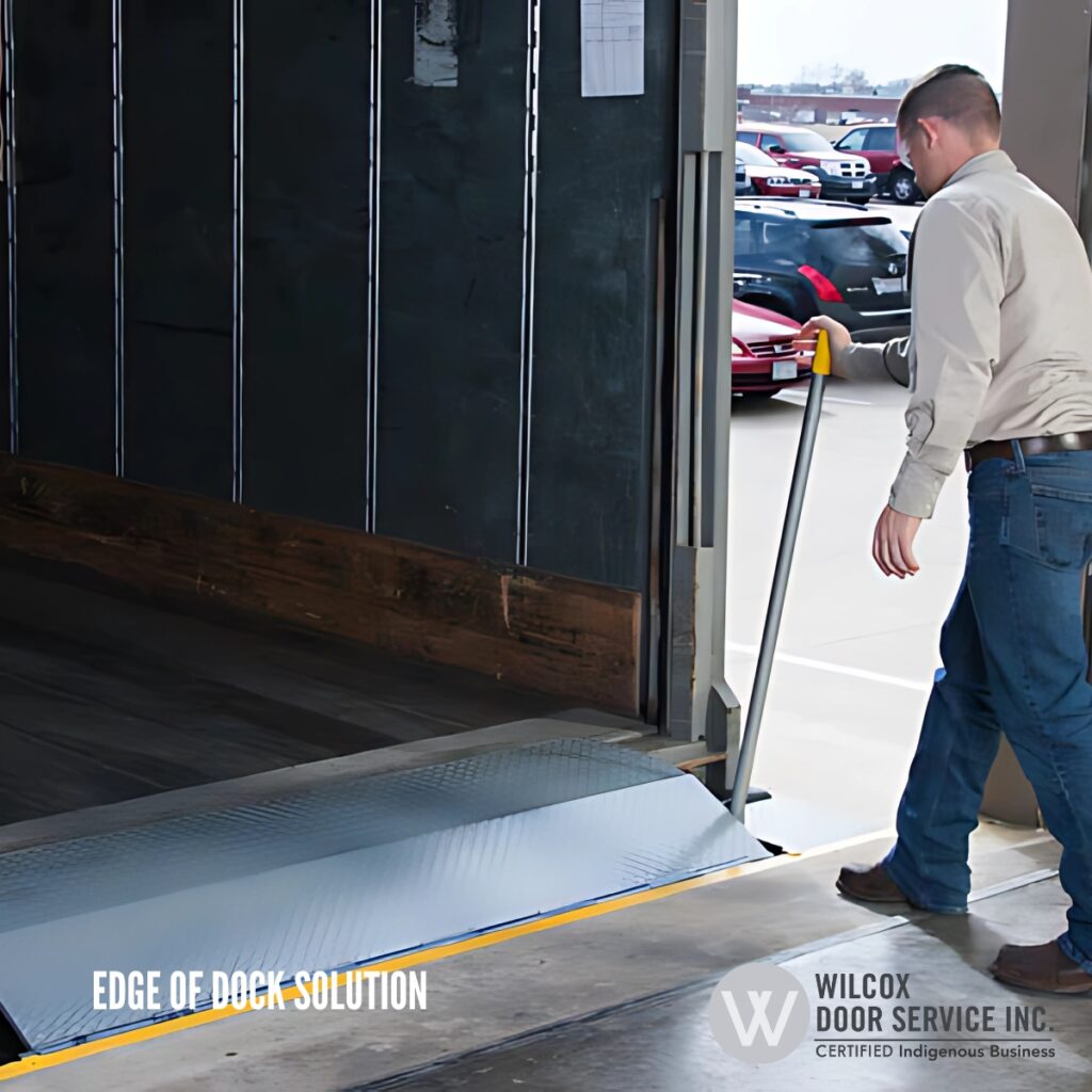 Worker beside an edge-of-dock leveler platform