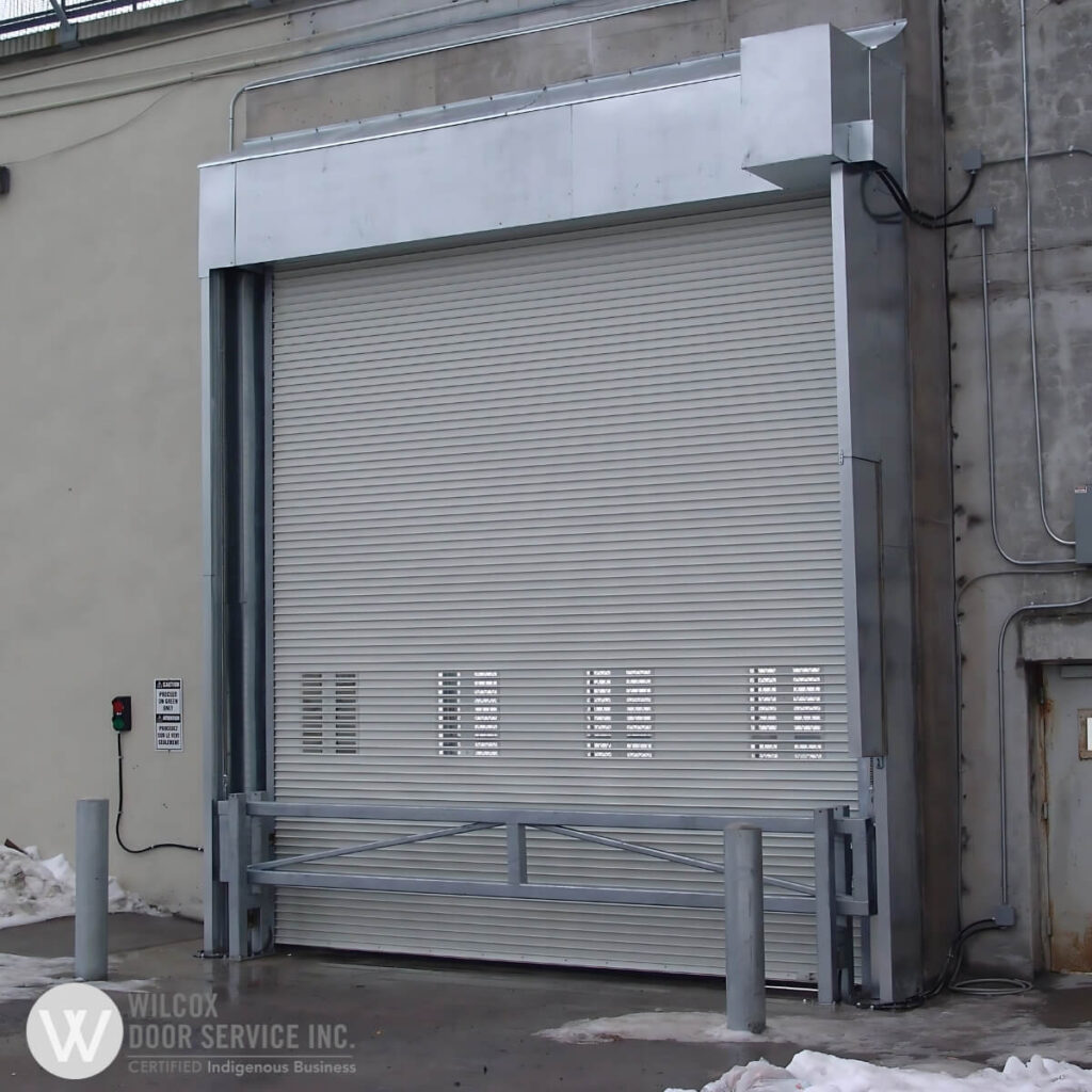 Rolling steel door with vision panels and a safety rail