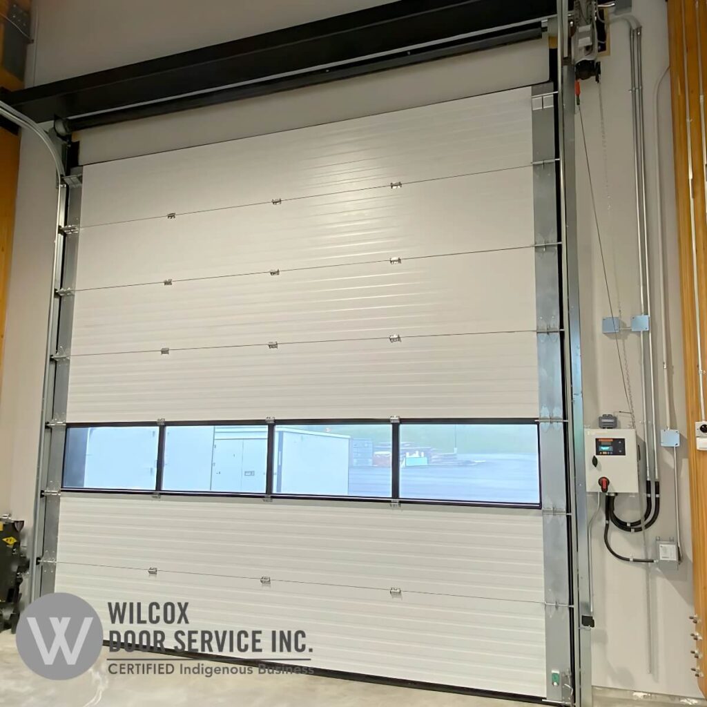Springless sectional door with rectangular windows