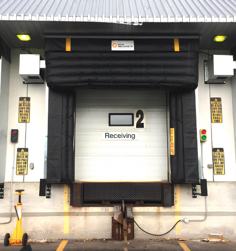 Adjustable inflatable dock seal at a receiving door