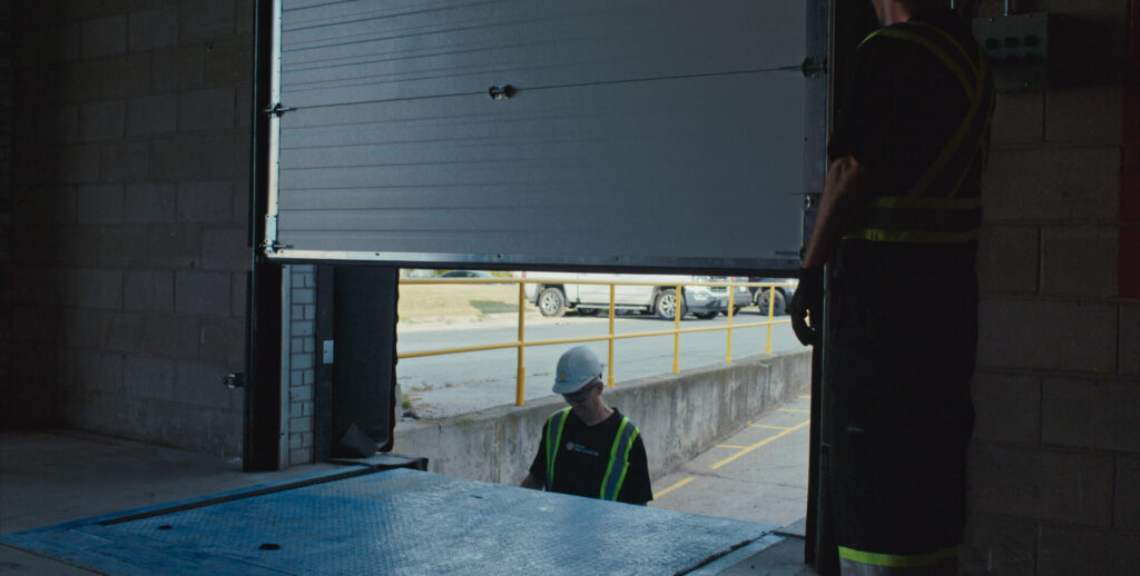 Industrial door retrofit and product upgrade service to improve efficiency and code compliance