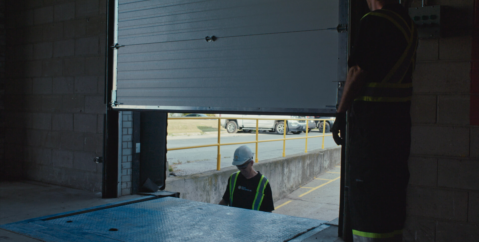 Industrial door retrofit and product upgrade service to improve efficiency and code compliance