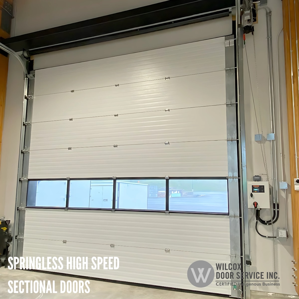 Springless sectional door with a row of windows