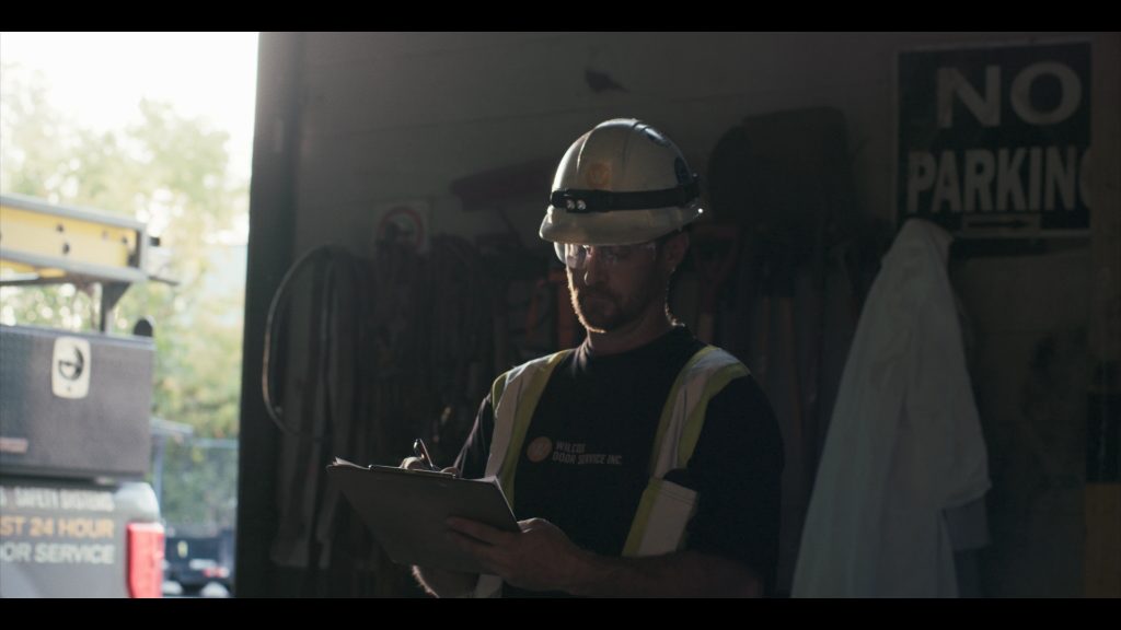 Wilcox technician documenting a service inspection at a government facility